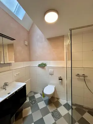 Ein Badezimmer in der Unterkunft Haus Ambiente