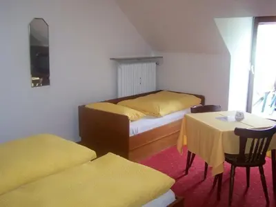 Ein Bett oder Betten in einem Zimmer der Unterkunft Hotel Am Ufer