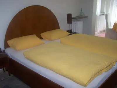 Ein Bett oder Betten in einem Zimmer der Unterkunft Hotel Am Ufer