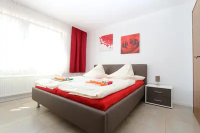 Ein Bett oder Betten in einem Zimmer der Unterkunft Gästehaus Am Römerbad