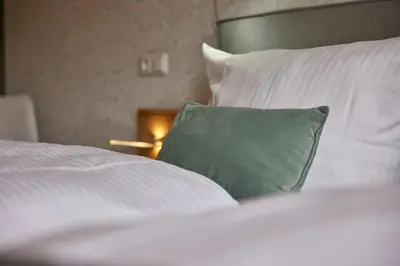 Ein Bett oder Betten in einem Zimmer der Unterkunft Weinhotel Mayer