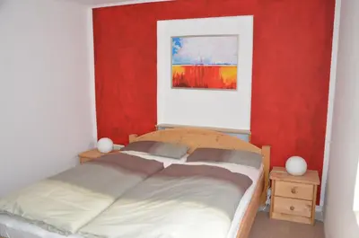 Ein Bett oder Betten in einem Zimmer der Unterkunft Ferienwohnung Römerbrücke