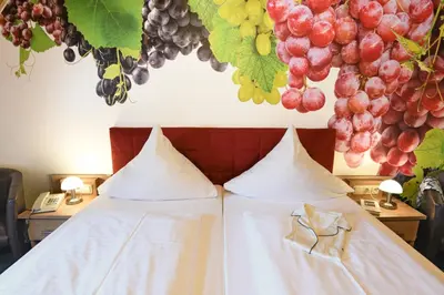 Ein Bett oder Betten in einem Zimmer der Unterkunft Moselstern-Hotel 
