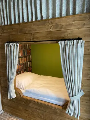 Ein Bett oder Betten in einem Zimmer der Unterkunft Ferienwohnung am Kirchberg