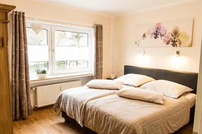 Ein Bett oder Betten in einem Zimmer der Unterkunft Haus Burgfee - Obere Etage