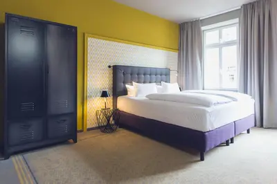 Ein Bett oder Betten in einem Zimmer der Unterkunft Hotel Goldene Traube - by Neugart