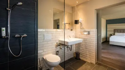 Ein Badezimmer in der Unterkunft Hotel Goldene Traube - by Neugart