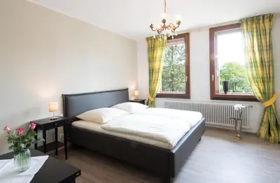 Ein Bett oder Betten in einem Zimmer der Unterkunft Altes Forsthaus