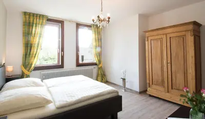 Ein Bett oder Betten in einem Zimmer der Unterkunft Altes Forsthaus