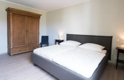Ein Bett oder Betten in einem Zimmer der Unterkunft Altes Forsthaus