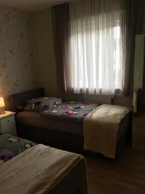 Ein Bett oder Betten in einem Zimmer der Unterkunft Ferienhaus Munterley