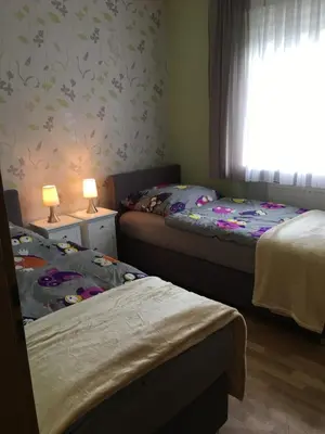 Ein Bett oder Betten in einem Zimmer der Unterkunft Ferienhaus Munterley