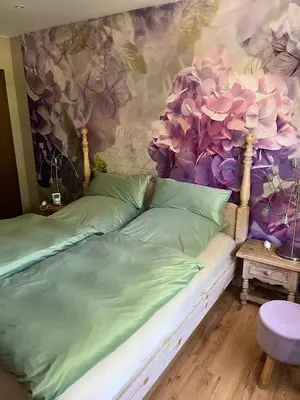 Ein Bett oder Betten in einem Zimmer der Unterkunft Ferienwohnung Weirich