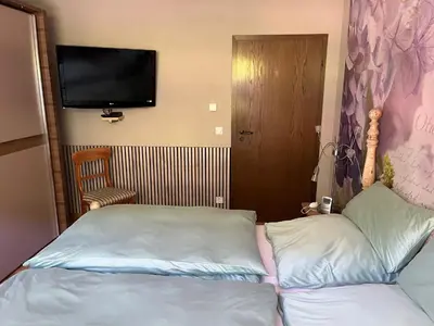 Ein Bett oder Betten in einem Zimmer der Unterkunft Ferienwohnung Weirich