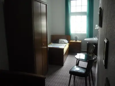 Ein Bett oder Betten in einem Zimmer der Unterkunft Hotel an der Fähre