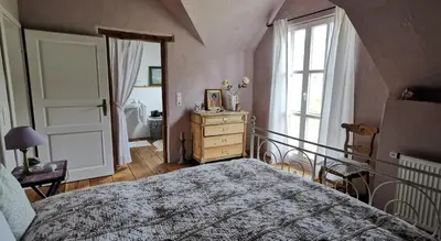 Ein Bett oder Betten in einem Zimmer der Unterkunft Ferienhaus Vulkaneifel Landhaus Loogh