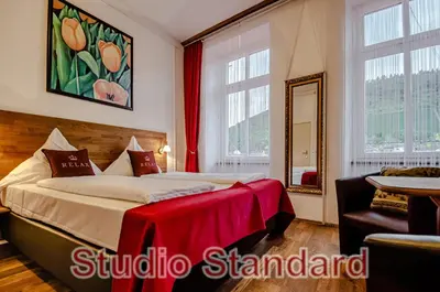 Ein Bett oder Betten in einem Zimmer der Unterkunft MoselUnion - Aparthotel Landsknecht