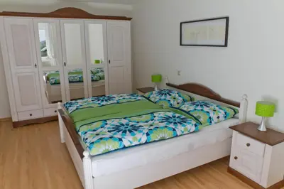 Ein Bett oder Betten in einem Zimmer der Unterkunft Bernkasteler Moselpanorama