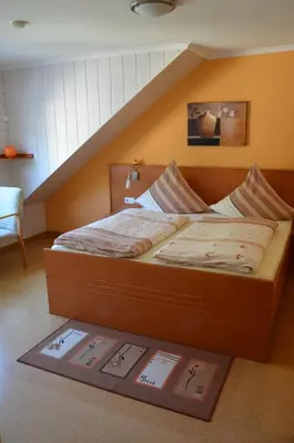 Ein Bett oder Betten in einem Zimmer der Unterkunft Ferienwohnung Lenartz