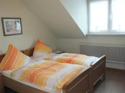 Ein Bett oder Betten in einem Zimmer der Unterkunft Gästehaus Neises