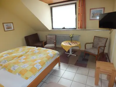 Ein Bett oder Betten in einem Zimmer der Unterkunft Gästehaus Neises