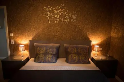 Ein Bett oder Betten in einem Zimmer der Unterkunft Mosel-Suiten