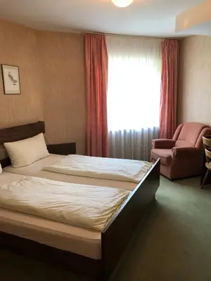 Ein Bett oder Betten in einem Zimmer der Unterkunft Gästehaus Rehwinkel