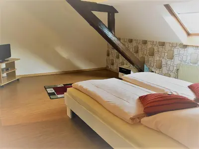 Ein Bett oder Betten in einem Zimmer der Unterkunft Moselhotel Ludwigs