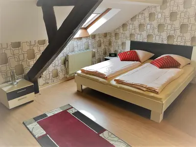 Ein Bett oder Betten in einem Zimmer der Unterkunft Moselhotel Ludwigs