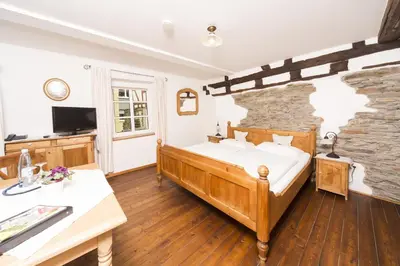 Ein Bett oder Betten in einem Zimmer der Unterkunft Altes Stadttor
