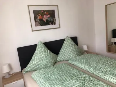 Ein Bett oder Betten in einem Zimmer der Unterkunft Gästehaus Ziemons