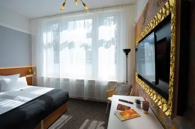 Ein Bett oder Betten in einem Zimmer der Unterkunft Hotel Kleiner Riesen