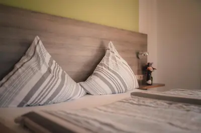 Ein Bett oder Betten in einem Zimmer der Unterkunft Urlaubsweingut Zecherhof