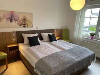 Ein Bett oder Betten in einem Zimmer der Unterkunft Weingut Bernd Hermes