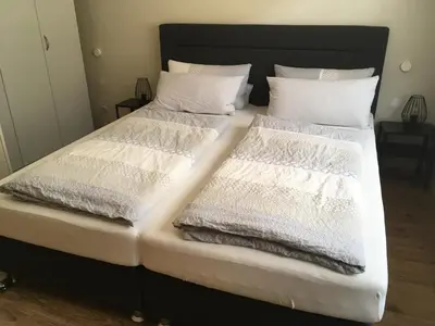Ein Bett oder Betten in einem Zimmer der Unterkunft moselferienwohnungen-uerzig