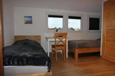 Ein Bett oder Betten in einem Zimmer der Unterkunft Ferienwohnung Eport
