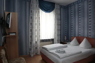 Ein Bett oder Betten in einem Zimmer der Unterkunft Hotel Sessellift