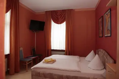 Ein Bett oder Betten in einem Zimmer der Unterkunft Hotel Sessellift
