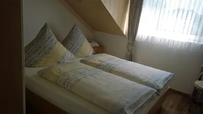 Ein Bett oder Betten in einem Zimmer der Unterkunft Ferienwohnung Haus Kotthoff