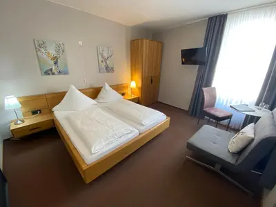 Ein Bett oder Betten in einem Zimmer der Unterkunft Weingutshotel Piesporter Goldtröpfchen