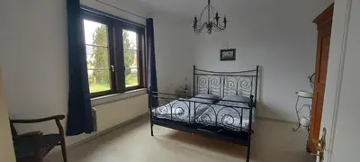 Ein Bett oder Betten in einem Zimmer der Unterkunft Zum Alten Pfarrhaus