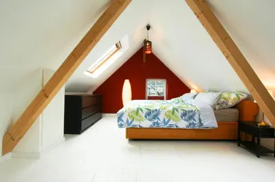 Ein Bett oder Betten in einem Zimmer der Unterkunft Ferienhaus Atelier