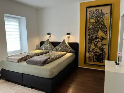 Ein Bett oder Betten in einem Zimmer der Unterkunft Ferienwohnung1 Daun