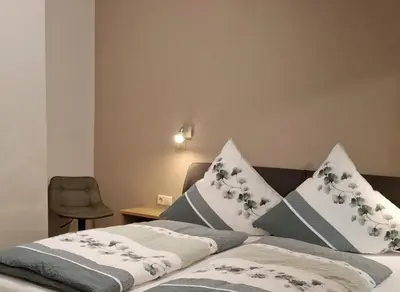 Ein Bett oder Betten in einem Zimmer der Unterkunft Zum Weingutsmuseum