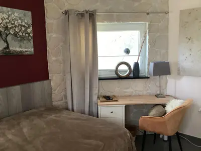 Ein Bett oder Betten in einem Zimmer der Unterkunft Ambiente Wohnen im Garten