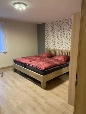 Ein Bett oder Betten in einem Zimmer der Unterkunft Ferienwohnung Susanna