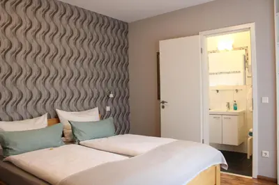 Ein Bett oder Betten in einem Zimmer der Unterkunft Weingut Markus Junglen