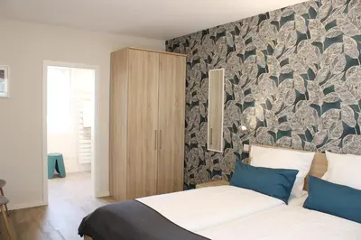 Ein Bett oder Betten in einem Zimmer der Unterkunft Weingut Markus Junglen