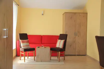 Ein Sitzbereich in der Unterkunft Waldhotel Albachmühle