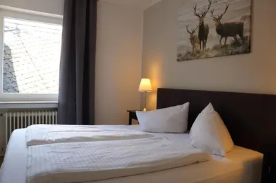 Ein Bett oder Betten in einem Zimmer der Unterkunft Hotel St. Georg